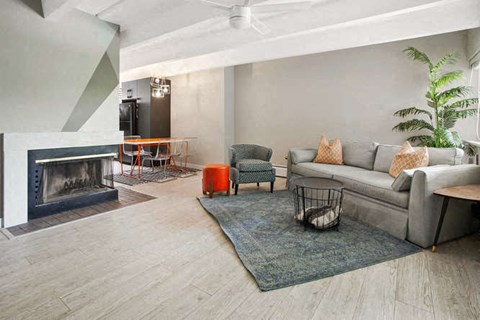 a living room with a couch and a fireplace
